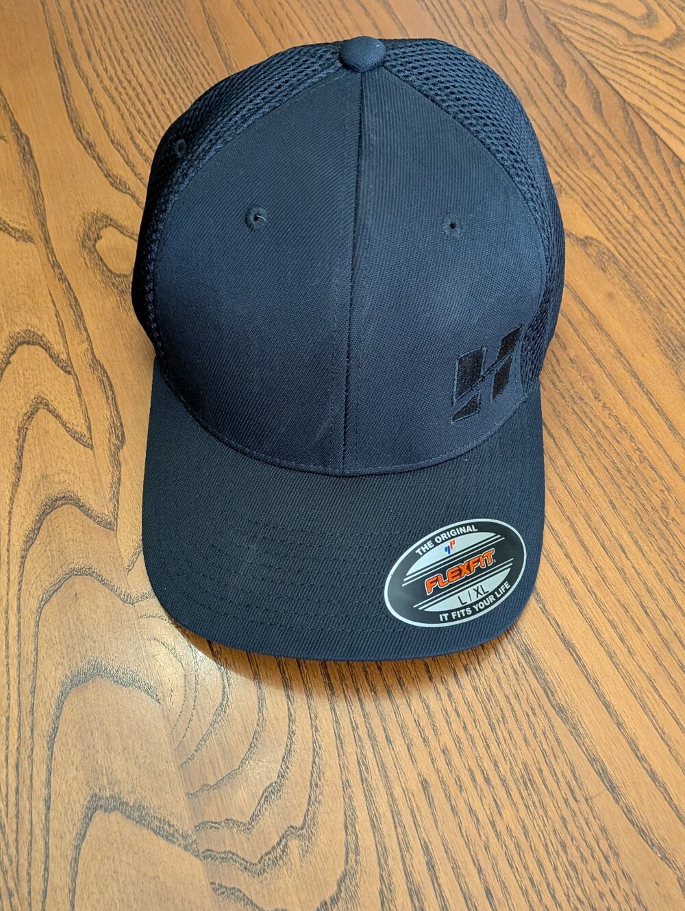 Black Flexfit Mesh Back Cap with Subtle Logo. Size L-XL